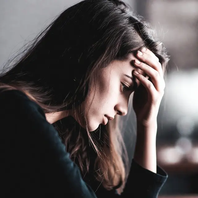 Woman processing the emotional impact of being laid off