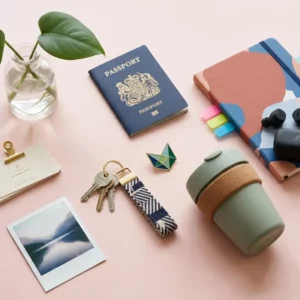 Modern editorial flat-lay of profession-symbol objects on a cream surface, representing the components of identity capital.